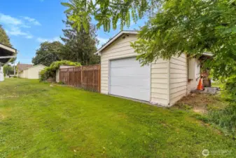 Alley access to roll up garage door in shop