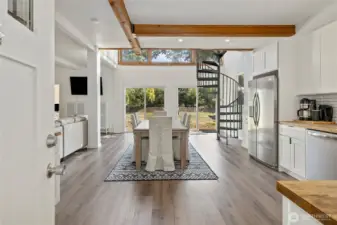 Enter to an open main level filled with natural light from large picture windows.