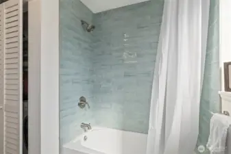 Stylish finishes and updated tile work in the bath.