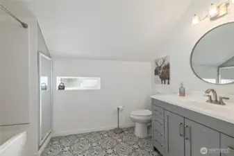 Primary ensuite bath with thoughtful upgrades.