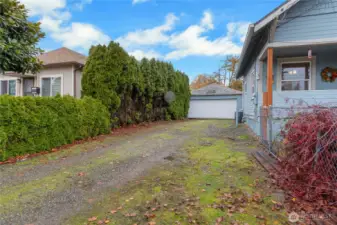 Show large garage in back.