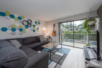 Light and bright living room with slider to deck.