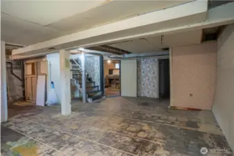 Downstairs is nearly 1,000 square feet. Do nothing and have tons of storage, but the smart money is on a revamp- add bedrooms, rec room, media space, or whatever your little heart desires.  The ceiling height allows for tons of options.