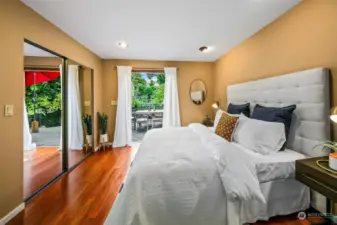 Primary upper bedroom with French doors to huge second story deck