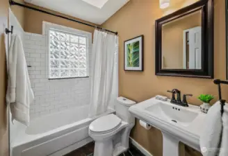 Full bath on second level with pocket door to bedroom