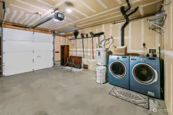 Full size washer an dryer in the oversized garage, store all your PNW gear!