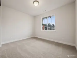 Main floor bedroom. Photos are of the actual home.