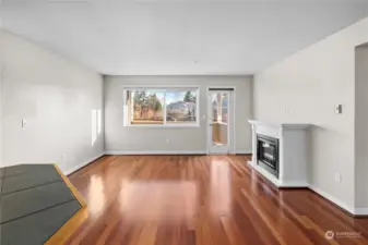 Living room with gleaming hardwood floors.