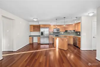 Island kitchen with newer Stainless Steel appliances.