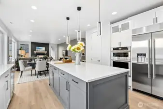 A second wall mounted oven with microwave. Ample storage on both sides of the large island.