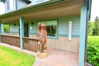 Custom carving is attached to the railing so he stays.