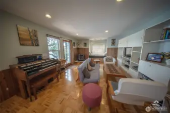 Living room with water views and easy access to the deck.
