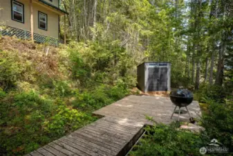Small storage shed for storing the patio furniture and BBQ.