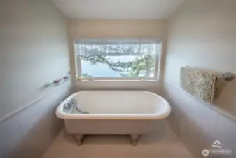 Soaking tub with a view on upper level.