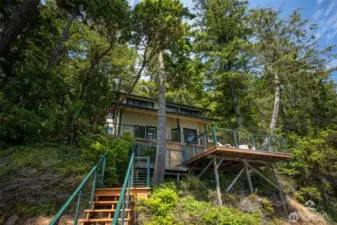 View of home from lower deck. The 1,000 Sqft of decking give the option to Take is the sun or hideaway in the shade.