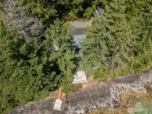 Aerial looking down on the home and waterfront.