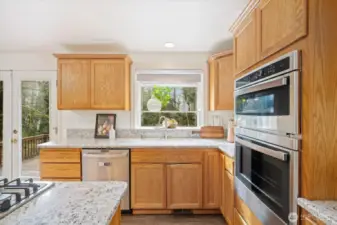Brand new cooktop and window view to the open backyard