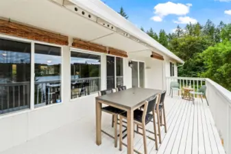 Spacious back deck with views of Burley Lagoon and forested backdrop