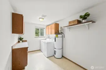 Laundry room with washer and dryer stays with the house.