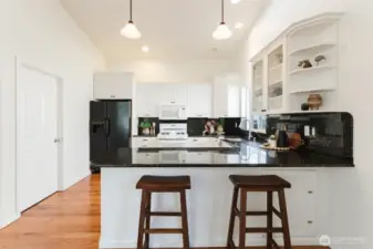 Eating bar separates the kitchen from dining space