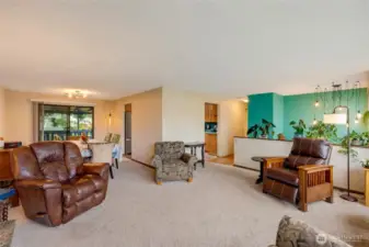 Angle looking from living area to dining room & kitchen