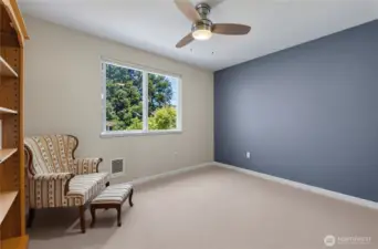 second spacious bedroom-this room has had most of the belonging digitally removed to see the space. No baseboards in the house anymore either, all have been replaced with in-wall units