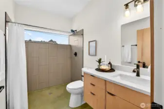 Main floor bathroom feature zero barrier shower entry.