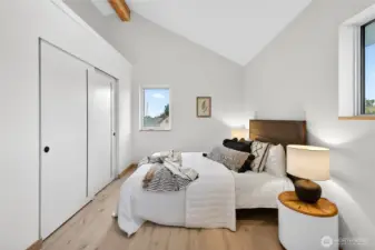 One of the four upstairs bedrooms featuring plenty of storage.