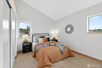 One of the four spacious upstairs bedrooms featuring plenty of natural light.