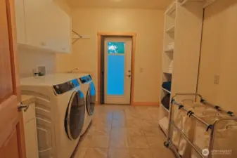 Laundry Area opens to deck and connects to primary