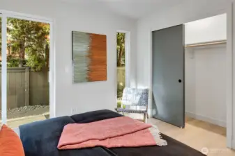 Expansive vertical windows & doors, blurring the line between indoors & nature. Generous closet space provides ample storage.