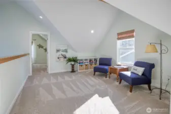 Spacious loft is the perfect place for guests to hang out or sit and relax with a good book