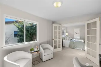 View from sitting room back into primary bedroom