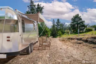 Virtually staged-RV parking area on site with power and septic access