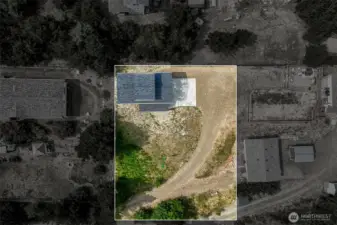 Approximate lot area from above-lower corner is RV parking area with power and septic access