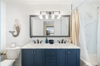 Full bathroom off the primary suite.