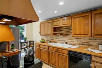 The kitchen is clean and functional, and awaits your personal touches to make it your own.  There is a brand new Amana Smoothtop Electric range and a Whirlpool 20.5 cubic foot stainless steel refrigerator.