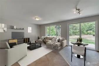 The spacious family room located off the kitchen. The slider opens to a nice low maintenance aggregate patio.