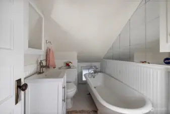 Upstairs bathroom offers a quintessential clawfoot tub for a home built in 1900.