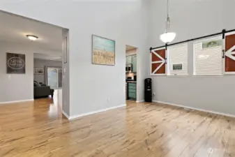 Dining room with soaring ceiling.