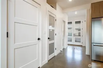 Frosted glass interior doors brighten the home by letting in more natural light while maintaining privacy.