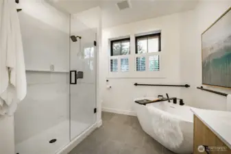 Glass shower doors with dual shower controls.