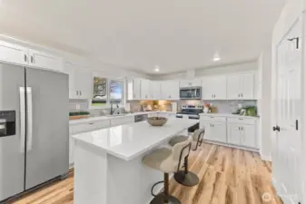 This kitchen is an absolute dream. Quartz counter tops. SS appliances. Large center island.