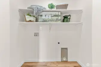 Perfectly placed laundry nook behind bifold doors