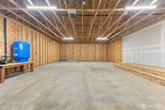 Oversized garage could fit 4 cars or 2 with a large workshop area