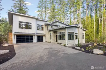 Main house, 3 car garage and a separate suite up the outdoors stairs for guests or the ultimate home office/business