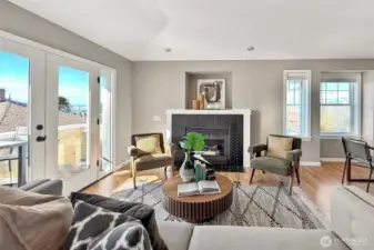 Light-filled living room with cozy gas fireplace and large windows