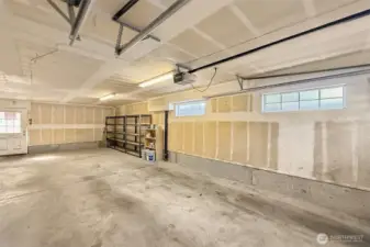 Spacious garage with room for 2 cars + storage or workspace