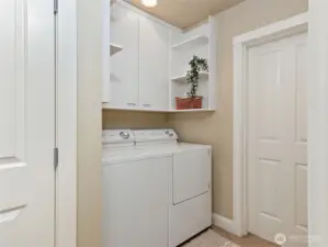 Utility area with washer and dryer.