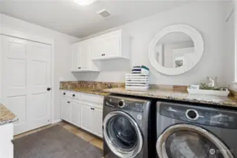 Very large laundry area with built in cabinets